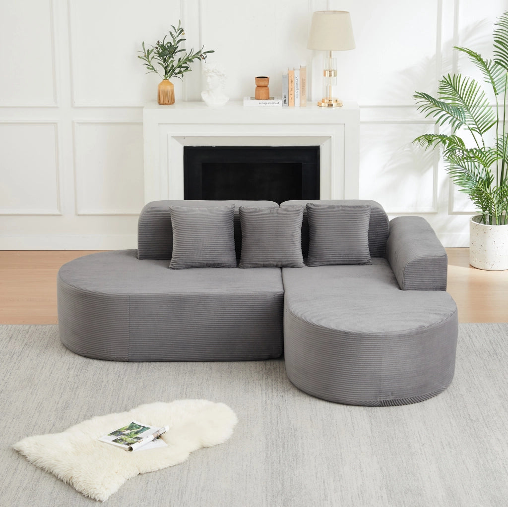 Divano angolare ULEVR 220x155x70 cm in velluto a coste grigio, con chaise longue curva e 3 cuscini