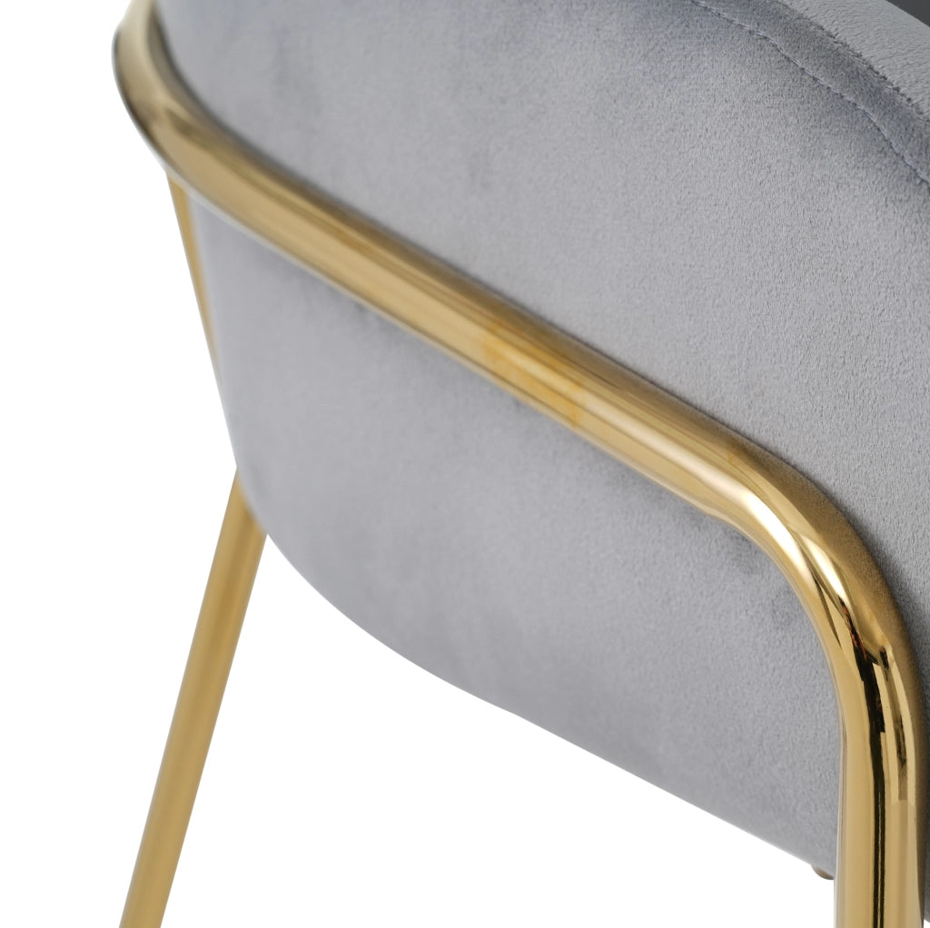 Sedia da pranzo singola in velluto grigio con gambe in metallo, design elegante e moderno