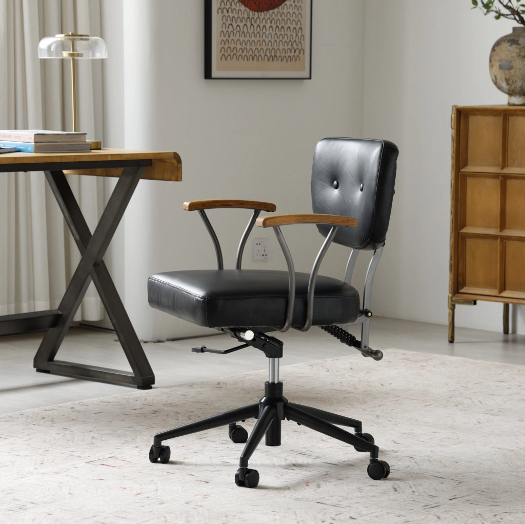 Sedia da ufficio in pelle nera girevole con ruote
