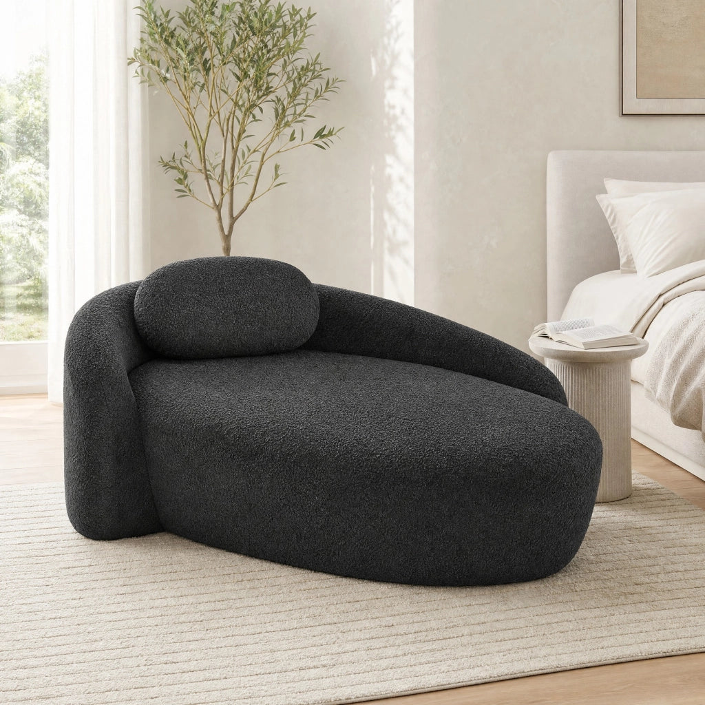 Divano compatto dal design arrotondato in tessuto teddy nero con cuscino