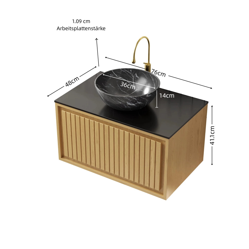 Mobiletto con lavabo sospeso in ceramica effetto pietra con piano in pietra sinterizzata nero e cassetto rovere dorato