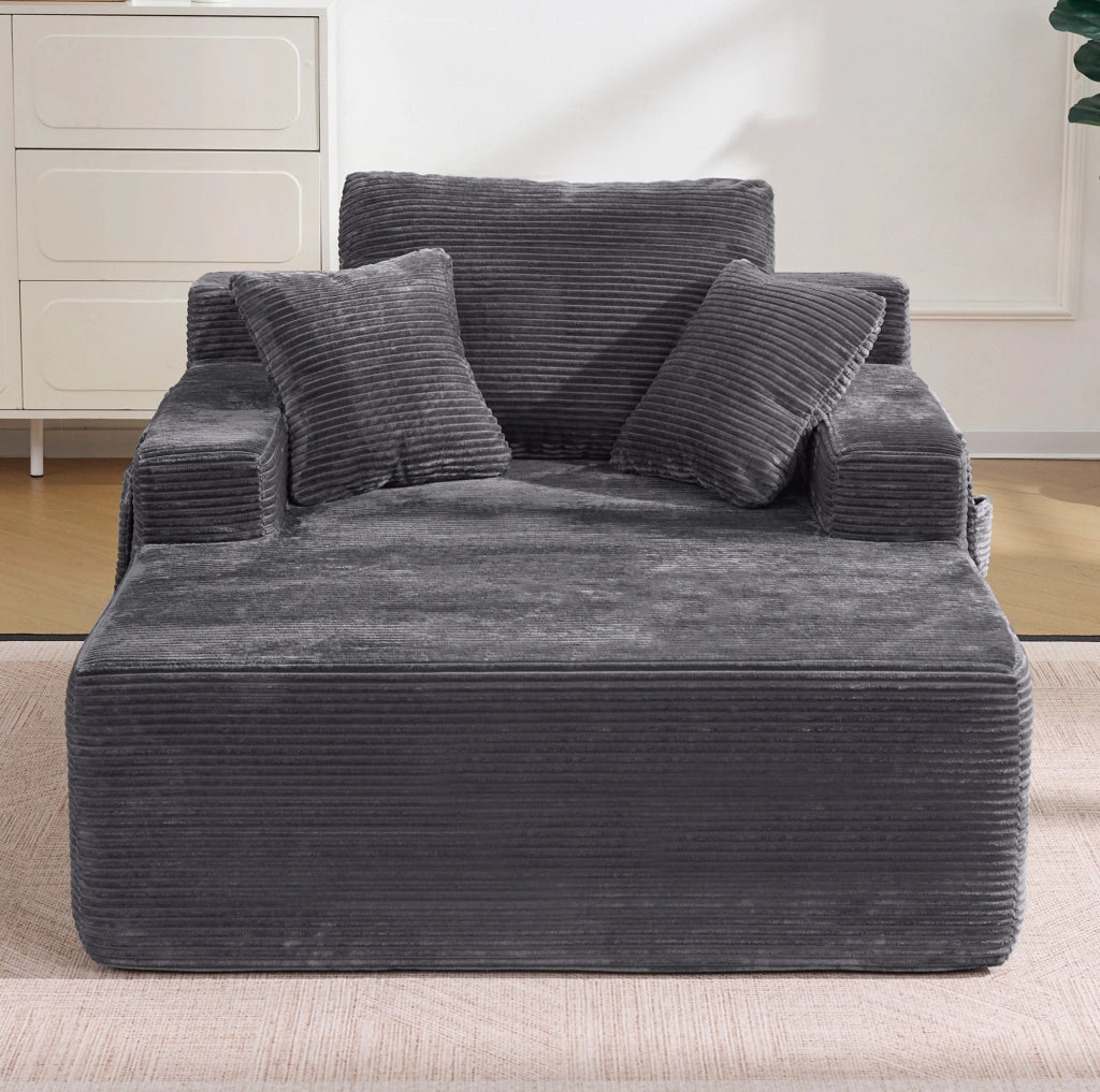 Divano da relax in tessuto a coste grigio scuro con tasche laterali HOMVRA