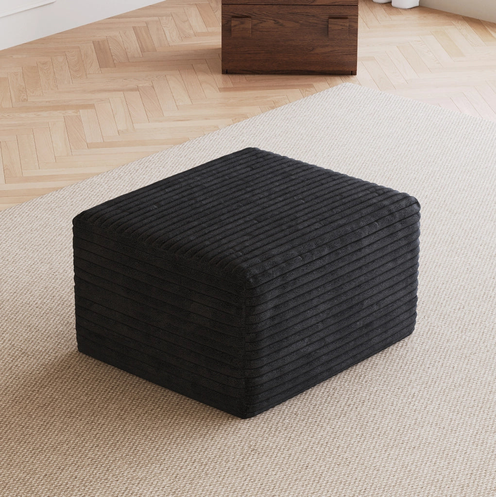 Pouf in tessuto nero senza montaggio
