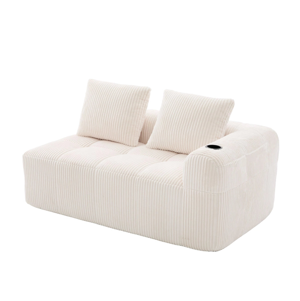 Divano compatto beige in velluto a coste con portabicchieri
