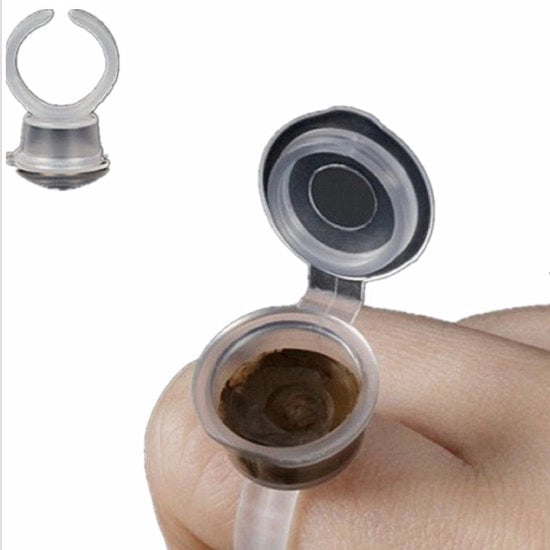 Kit per tatuaggi con contenitore a coperchio per 100 inchiostri.
