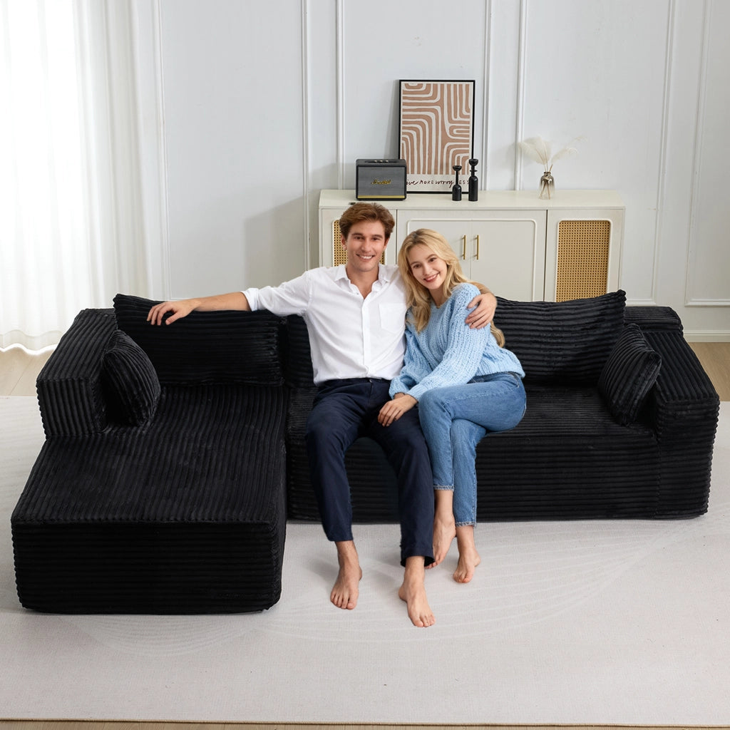 Divano angolare modulare con chaise longue e seduta profonda, senza montaggio, in velluto a coste nero