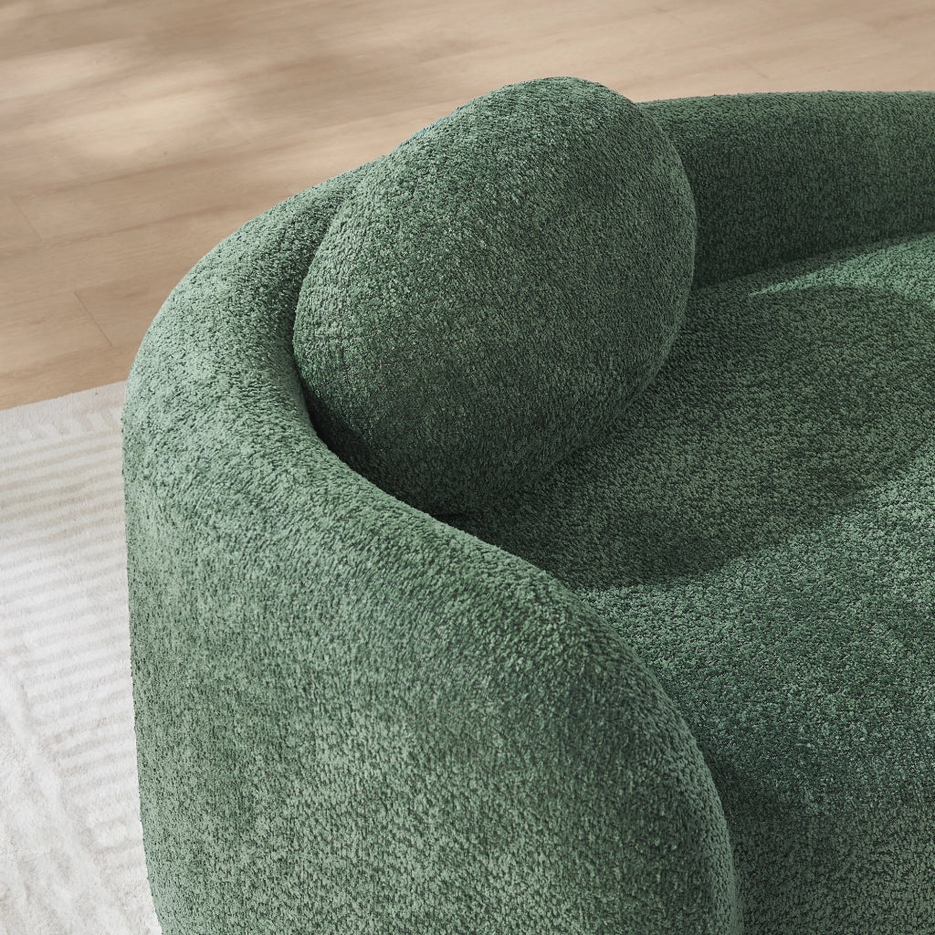 Divano compatto dal design arrotondato in tessuto teddy verde con poggiatesta