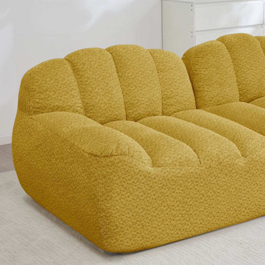 Divano modulare angolare 4 posti con ottomana, seduta profonda e braccioli ergonomici in pile granulato giallo