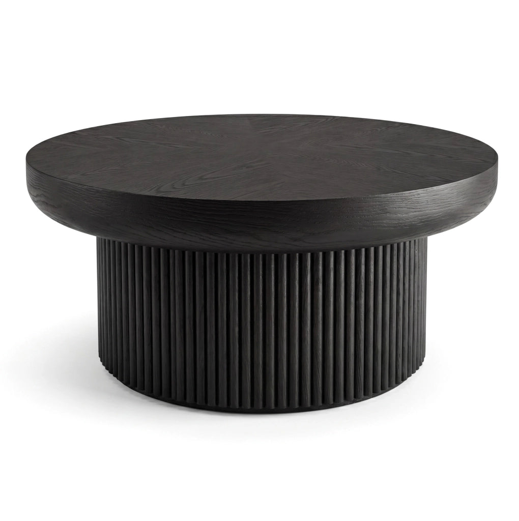 Tavolino rotondo nero con piano spesso e base scanalata