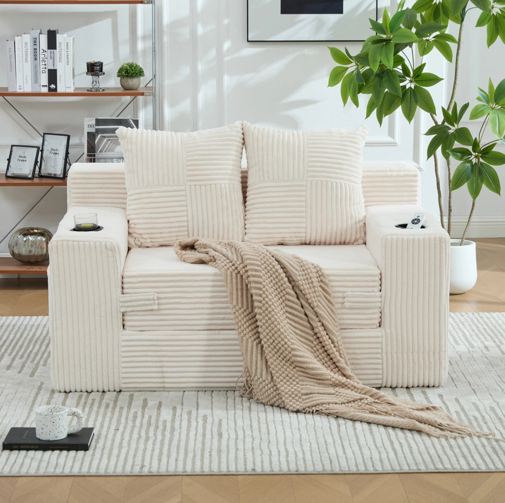 Pouf sofa in velluto a coste beige con 2 cuscini e tasche laterali; 151x133x64 cm